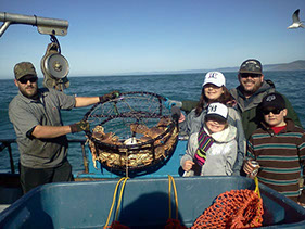 Photo of a family of fishers on a charter boat.