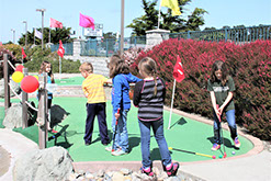 children playing video games at Ed's Mini Golf and Arcade Fort Bragg, CA