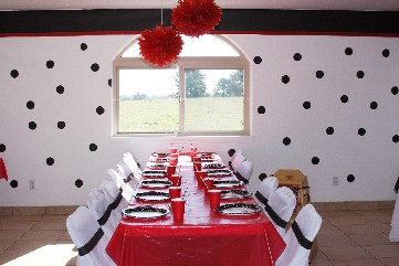 Bright colors of red, white and topped with black polka dots are the theme for this elegant party.