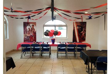 photo of party room decorated with halloween colors and party accessories.