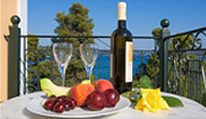 photo showing fruit and a bottle of wine.